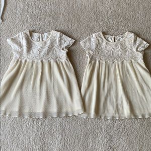 Twin girls matching embroidered and pleated dress